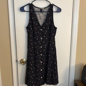 Black Sleeveless Dress with Button and Floral Details